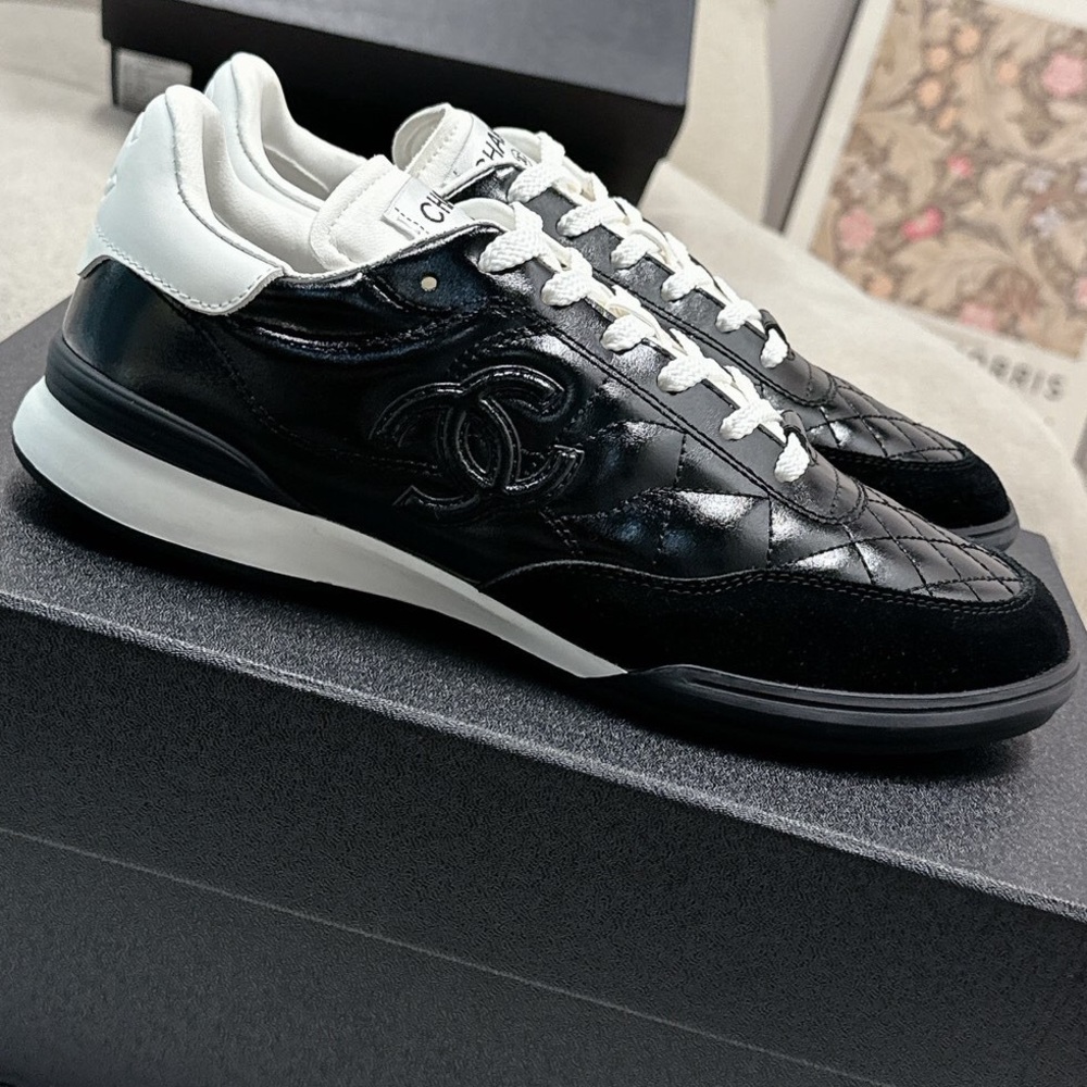Women's Chanel Black Quilted Patent Leather White Lace-Up Sneakers - Picture 2 of 7
